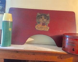 Old thermos and large cat advertising.