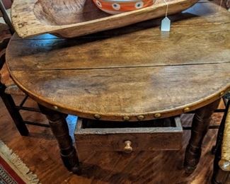 Late 1700s to early 1800s rustic farm table with large nailhead detail and working drawer.