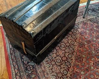American Wood strap trunk and 8 by 12 Persian handmade rug.