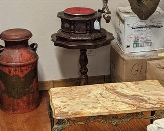 Painted vintage milk can, reproduction phonograph, French onyx top table.