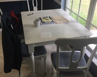 White kitchen table with four chairs