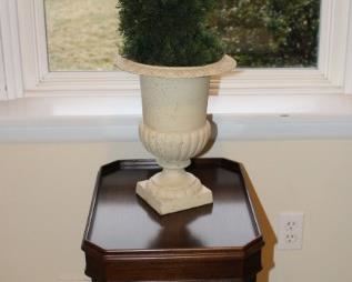 Small side table shown with urn.