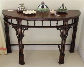 Large Asian style demilune shown with Mackenzie Childs decorator items. Measures: 48" W x 18" D x 30" in height.