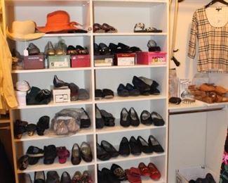 This walk in closet is full. Pictured are mostly size 10 and 11 shoes.