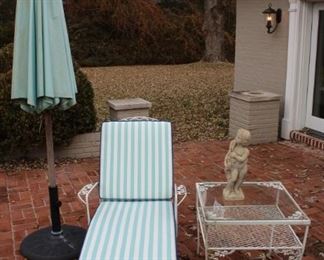 Chaise lounge chair with side table.