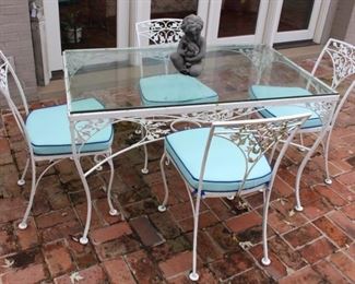 Vintage Woodard Acorn and Oak Leaf glass top table with four chairs shown with custom made Sunbrella cushions. This set works well as a kitchenette table.