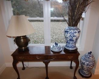 Baker console/sofa table shown with blue and white lidded ginger jars.