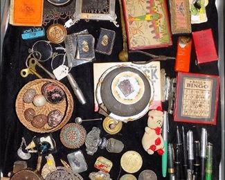 All sorts of very interesting small items.  Fountain Pins, Paper Goods, Jewelry, Military Items, Toys, etc.