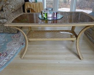 Coffee table with glass top.
