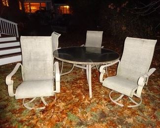 Patio round table with 4 swivel chairs.