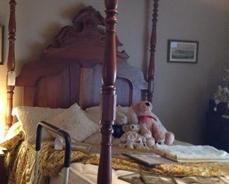 Full size tester bed.  Teddy bears,decorative pillows, framed prints