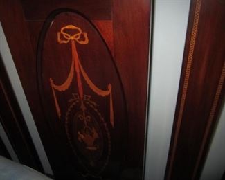 DETAIL OF EMBLEM ON HEADBOARD