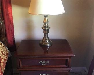 brass bottom lamp lording itself over the nightstand
