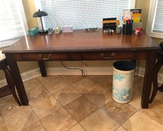 Big wooden desk could also serve to conduct small alien autopsies