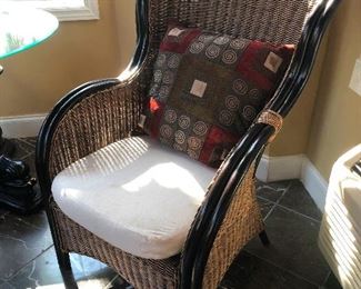 Rattan or wicker chair -- there is a difference but I forgot what it is, so if you know then track me down and explain it to me in detail it should take an hour, my name is Cheryl