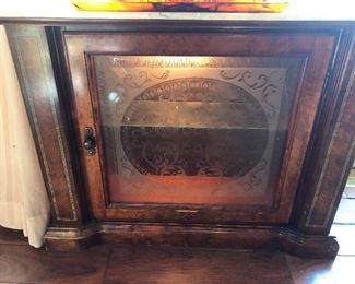 That's etched glass on the front of that cabinet there.