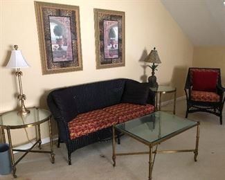 Snappy black wicker sofa and brass-bottom tables