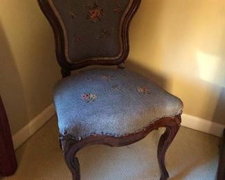 parlor chair on two legs