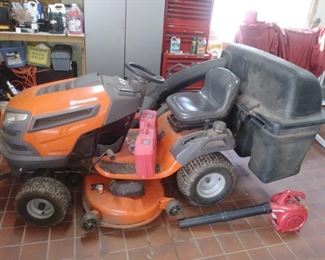 Husqvarna riding lawnmower with leaf pick up attachment. This riding lawnmower is six years old