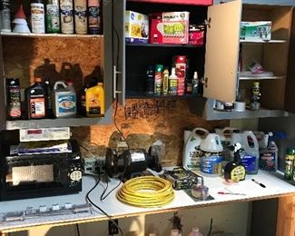 Spray paint, motor oil, chainsaw oil, microwave oven, car care products, assorted lightbulbs, yard chemicals, two Dewalt radios, vintage fan, Pool antifreeze and coolers