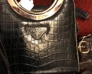 Large assortment of women’s purses including Prada, Gucci and Versace