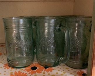 9 coke mugs. Very nice. 