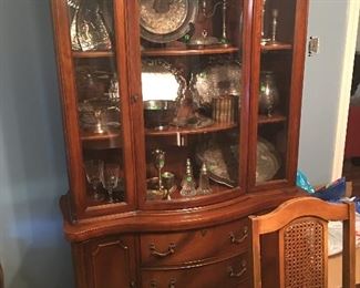 Dining room china cabinet...vintage.  Inside you see lots of silver plate items 