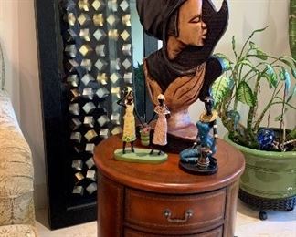 The decorative panel and the three small figurines are sold.