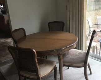 Dining Room Table with One Leaf and Four Upholstered Chairs 