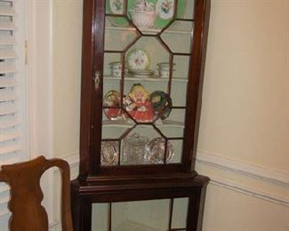 One of pair of corner cabinets
