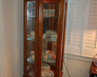 Lighted cabinet with MacKenzie-Child ceramics