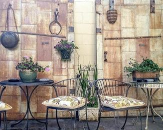 Rustic metal doors, wrought iron patio set, mirrored table