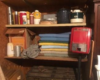 Large vintage trunk, moving blankets, coin changer, ice cream maker, vintage thermoses. 