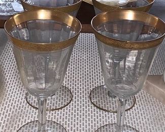 4 of 10 Gold rimmed wine glasses 