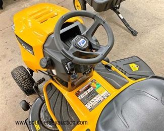  LIKE NEW Cub Cadet XT1 Enduro Series Mower Tractor, 46" Signature Cut Mower Deck and Polar Trailer by Clam 