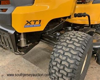  LIKE NEW Cub Cadet XT1 Enduro Series Mower Tractor, 46" Signature Cut Mower Deck and Polar Trailer by Clam 