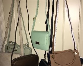 Many designer brand handbags.