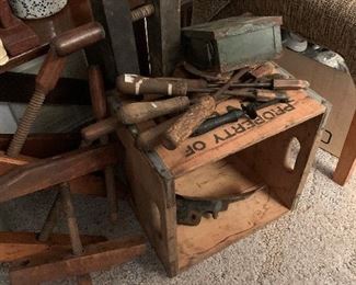 Several old tools and boxes.
