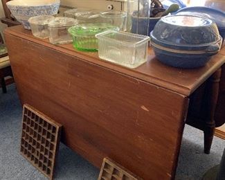 Nice older table - good for a smaller wall because it folds so well, and the refrigerator bowls are great.