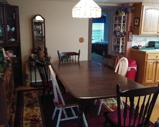 Dining Room Table with 4 matching chairs.  Has leaf to expand even larger