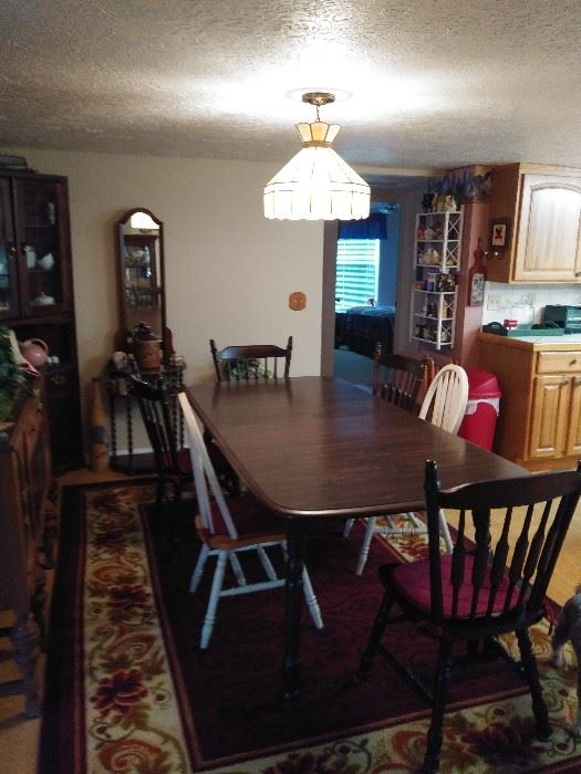 Dining Room Table with 4 matching chairs.  Has leaf to expand even larger
