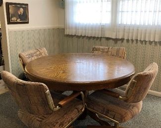 21	Round oak dining table (no leaves) 48" diameter with 4 rolling chairs. Table top as is condition.	 $100.00 	  