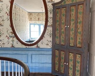 PAINTED CORNER CABINET AND LARGE OVAL BEVELED MIRROR