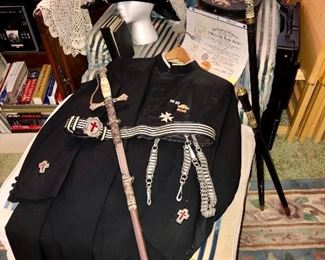 Masonic regalia...Frock coat, sword and belt, plumed hat, and books.