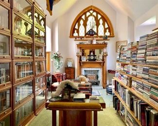 Beautiful library filled with books, 4 tall barrister book cases, an amazing library/writing desk, quilts, antiques, and so much more!