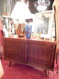MID CENTURY MODERN TEAK SIDEBOARD/BUFFET, CIRCA 1950's, WITH BASKET WEAVE MOTIF FRONT SLIDING DOORS