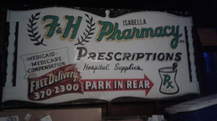 Huge metal sign from Fred Isablella's Pharmacy on Union Street.  
