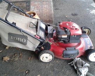 One of the 2 lawn mowers