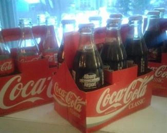 Collectible coca-cola bottles-2 6 packs of full ones-and 1 set of 4, empty