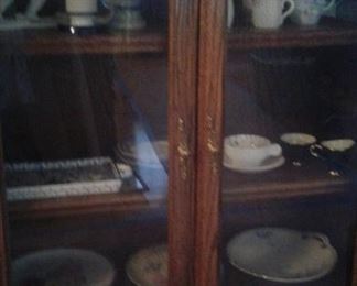 glass doors/bookcase with assorted china collectibles